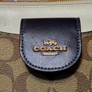 Coach bag with card attachment